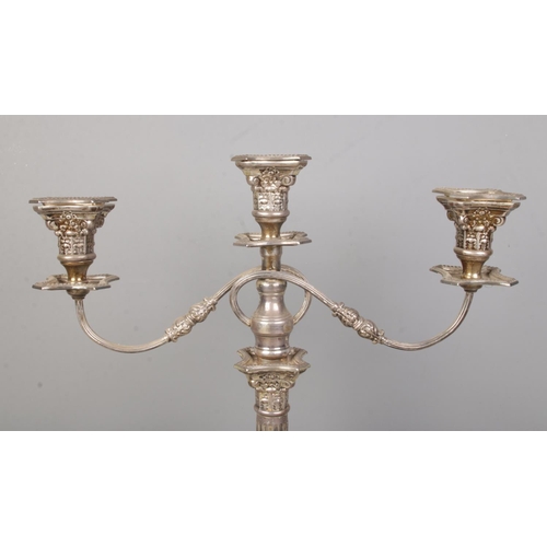 97 - A large George V silver twin branch candelabra with Corinthian column and stepped base. Assayed Lond... 