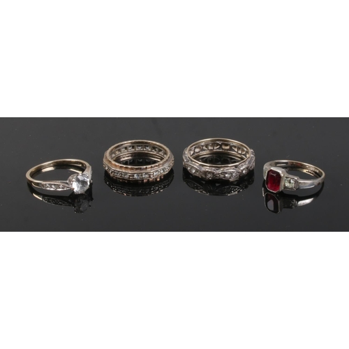 526 - Four 9ct gold and silver paste set dress rings.