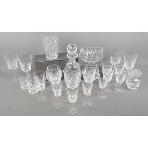 392 - A good collection of Waterford crystal. Includes decanter, two brandy glass, wine glasses, etc.