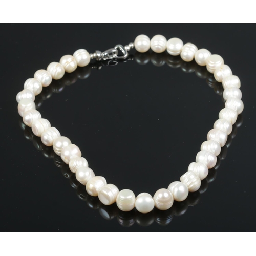 535 - A Jersey Pearl necklace with silver clasp and original bag.