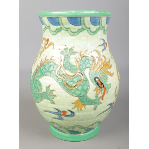 329 - A hand painted Crown Ducal vase. Decorated with a dragon and stamped 146 to the base. (22cm)