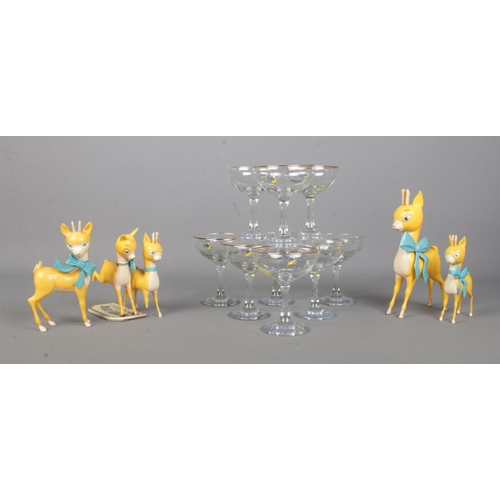 345 - A collection of Babycham to include nine drinking glasses and five fawn figures of varying sizes and... 