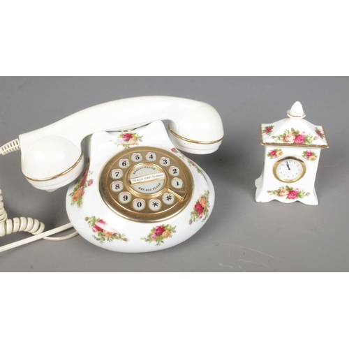 369 - Two pieces of Royal Albert Old Country Roses ceramics to include rotary phone and small mantel clock... 