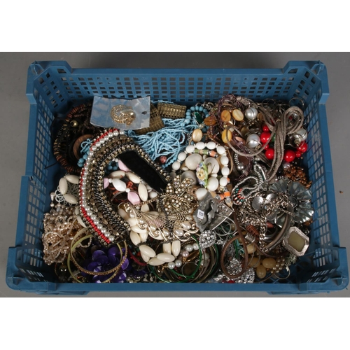 379 - A box of costume jewellery. Includes beads, earrings, necklaces, etc.