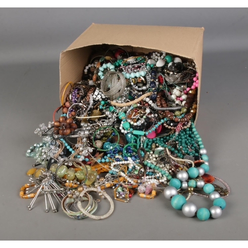 386 - A large box of costume jewellery including various necklaces and bracelets.