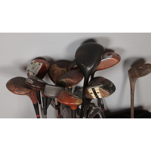 460 - A quantity of vintage golf clubs. Includes Spalding Professional, Ben Hogan, Taylor Made, etc.