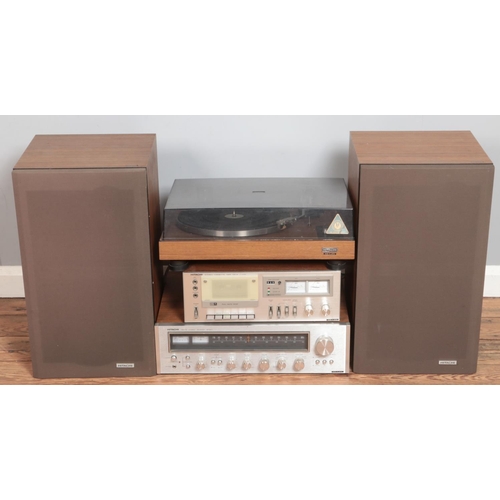 465 - A Hitachi hifi stacking system. Includes stereo receiver, turntable, pair of speakers, etc.