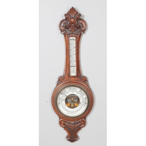 492 - A Victorian carved Aneroid barometer.

Hx90cm