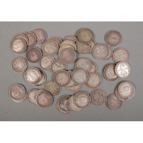 505 - A quantity of 1920 and earlier three pence silver coins, including Victorian examples. 69.5g