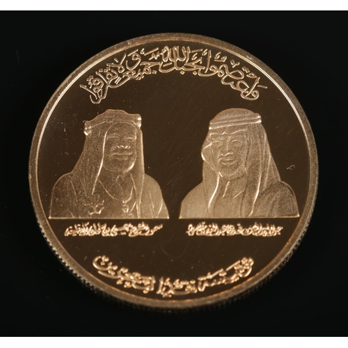 514 - 1986 Bahrain Saudi Causeway gold coin in original display case and sleeve. 31.18g.