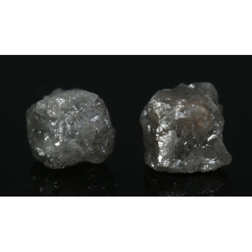 516 - Two rough uncut diamonds. Approx. 1ct total