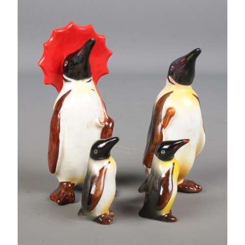 551 - A family of four Beswick penguins.