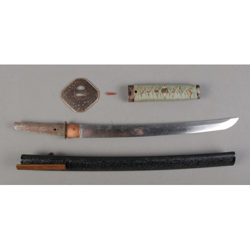 200 - A Japanese Meiji period Wakizashi. Having bronze Tsuba and wrapped Samegawa Tsuka with bird Menuki. ... 