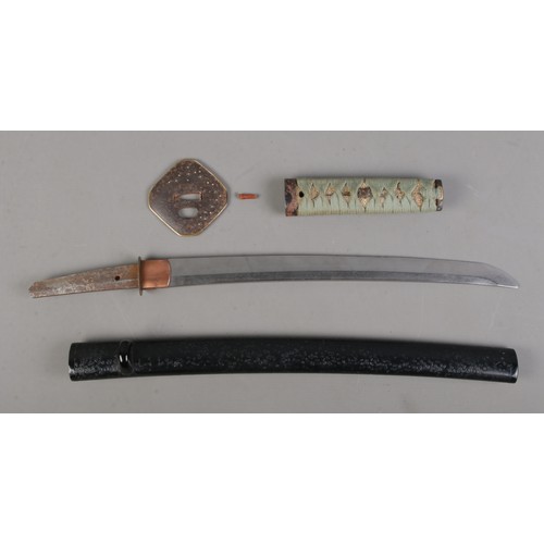 200 - A Japanese Meiji period Wakizashi. Having bronze Tsuba and wrapped Samegawa Tsuka with bird Menuki. ... 