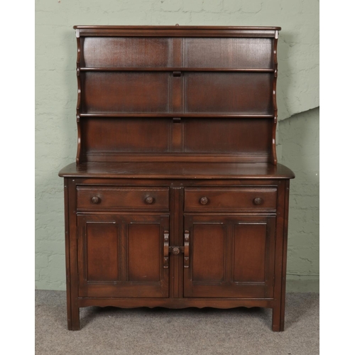 595 - A dark Ercol Old Colonial dresser.