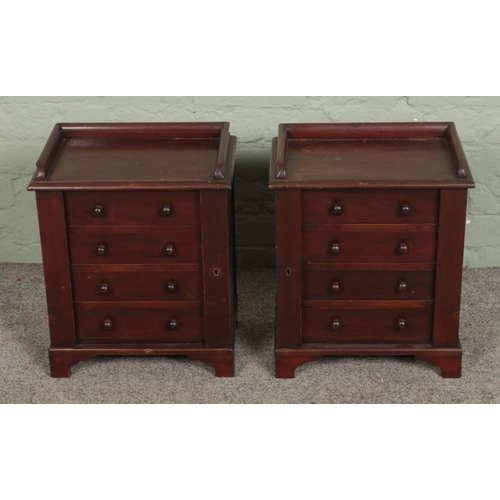 581 - A pair of mahogany four drawer Wellington style chests of small form. Approx. dimensions 37cm x 27cm... 