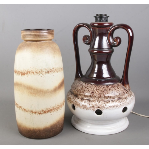 106 - A large West German pottery vase (38cm) along with a similar twin handled table lamp.