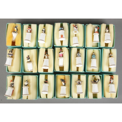 108 - Twenty seven boxed Meet The Penguins bone china thimbles.