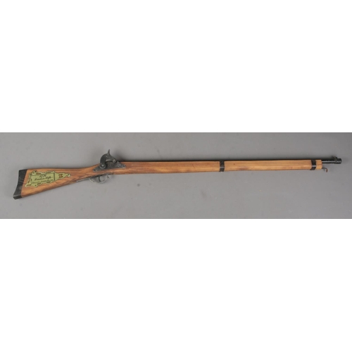 109 - A wooden replica 1776 Freedom Rifle. Length 94cm. CANNOT POST.