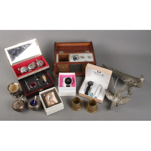 113 - A quantity of collectables. Includes Hira radio/table lighter, white metal cock and pheasant, trench... 