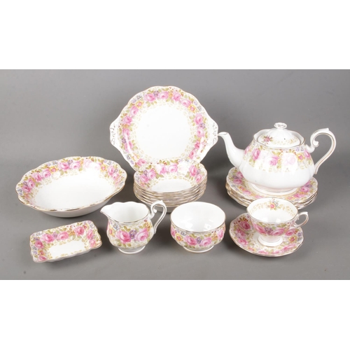 141 - A Royal Albert part tea service in the Serena pattern to include teapot, milk jug, sugar bowl, etc. ... 