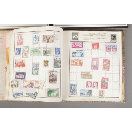 162 - A book of international stamps along with The Westminster Collection folder containing The Monarchs ... 