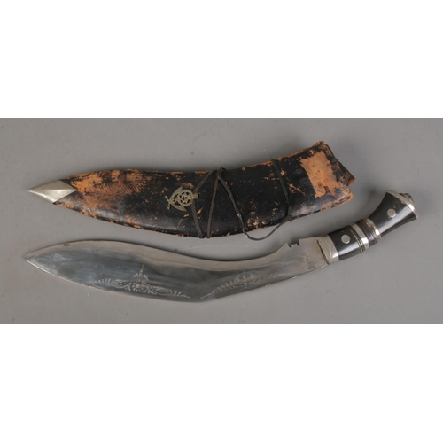 165 - An Indian Kukri knife featuring lion head pommel with scabbard. CANNOT POST OVERSEAS