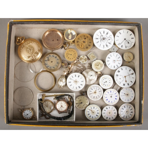 189 - A tray of watch parts. Includes pocket and fob watch movements, ladies manual watch heads; Roamer an... 