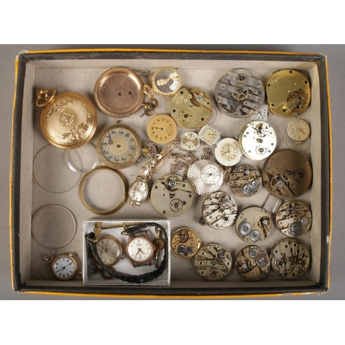 189 - A tray of watch parts. Includes pocket and fob watch movements, ladies manual watch heads; Roamer an... 