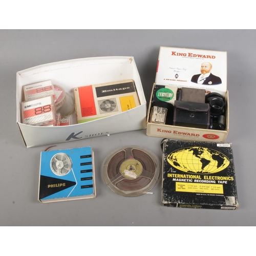 200 - A box of assorted video recording equipment to include several tapes, Dixons Autocrat Enlarging Lens... 