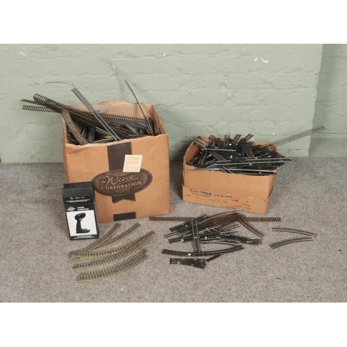 202 - Two boxes of assorted model railway track to include Hornby Dublo, OO gauge, O gauge, etc.