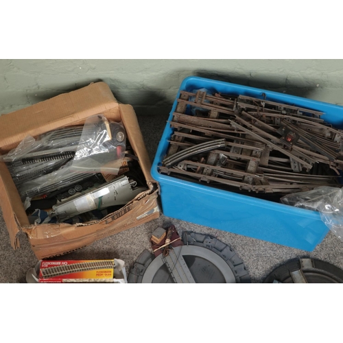 203 - Two boxes of assorted model railway track and accessories to include O Gauge, OO Gauge, Turntables, ... 