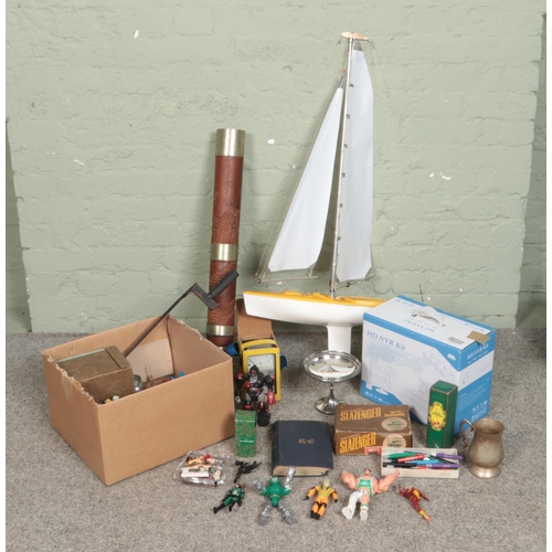 215 - A box of miscellaneous to include action figures, Slazenger tennis balls, silver plate, scratch buil... 