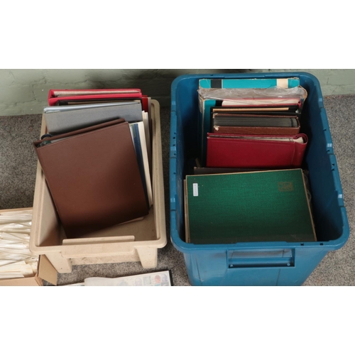 221 - Two boxes of assorted international stamp albums both complete and partially complete. Includes Cana... 