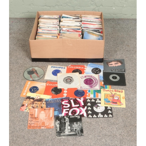 234 - A box of assorted vinyl singles of mainly pop and rock to include Madonna, Prince, Eurythmics, Madne... 