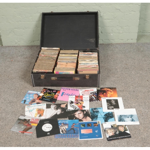 235 - A case of assorted vinyl singles of mainly pop and rock to include Madonna, David Bowie, Frankie Goe... 