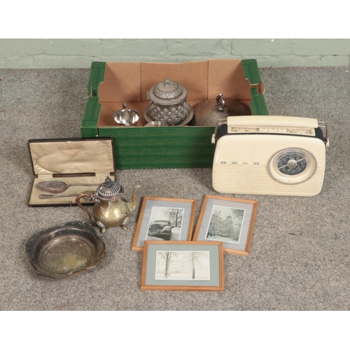 237 - A box of miscellaneous to include assorted brass, silver plate, Bush radio and three framed photogra... 