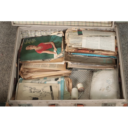 270 - A suitcase with contents of vintage sewing patterns, Airlyne rugmaker, linens, etc.