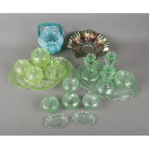 302 - A good collection of coloured glassware to include uranium glass butterfly dressing table set, art g... 