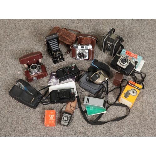 309 - A box of photographic equipment. Includes Kodak, Canon, Coronet cameras etc.