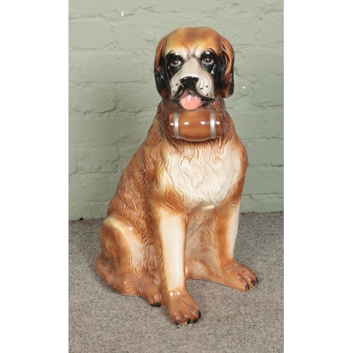 318 - A large St. Bernard ceramic dog. Approx. height 69cm.