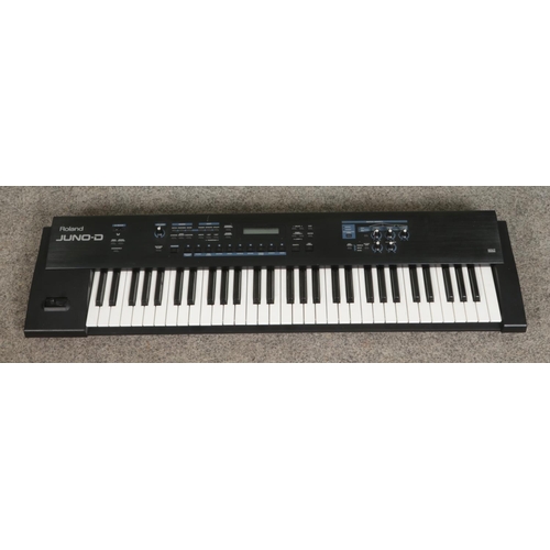 329 - A Roland Juno-D electric keyboard.