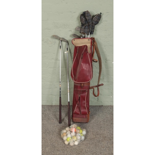 357 - A set of nine Spalding Job-Flite golf clubs with Spalding carry bag and small collection of golf bal... 