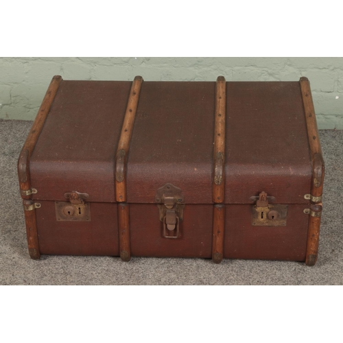 361 - A vintage wooden bound steamer trunk.