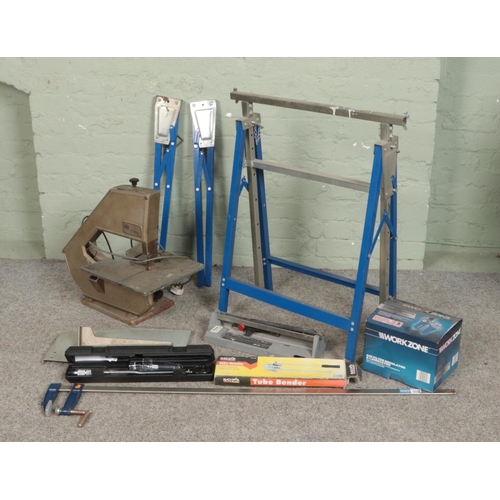 373 - A collection of tools and accessories. Includes Burgess band saw, Rolson clamp, Work Zone air filter... 