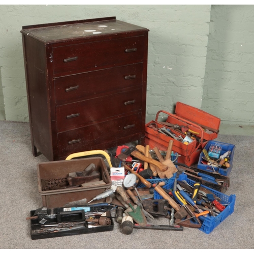 381 - An oak chest of drawers with contents of tools. Includes chisels, Thor hammer, drill bits, spanners ... 