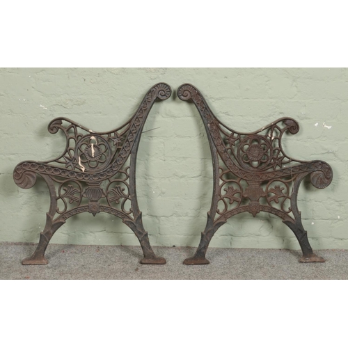 382 - A pair of cast iron bench ends.