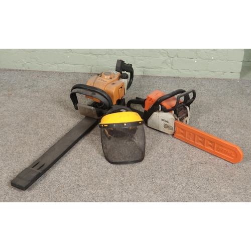 386 - A Stihl petrol chainsaw along with a Tivoli 63 petrol hedge trimmer and Rocwood safety visor.