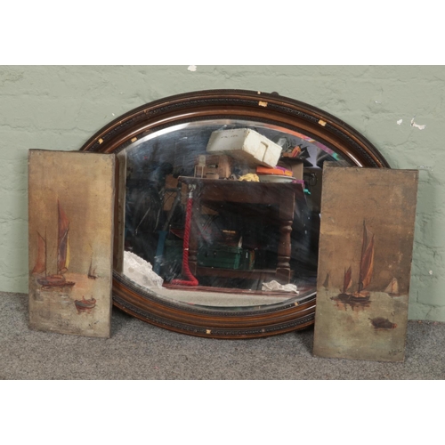 404 - J Cooper, a pair of oil on canvas, seascapes with boats, along with a mahogany framed oval mirror.