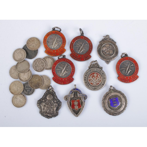 431 - A good collection of silver fobs along with quantity of pre-1920 British silver three pence coins. T... 